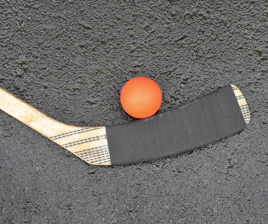 hockey still and ball on paved road