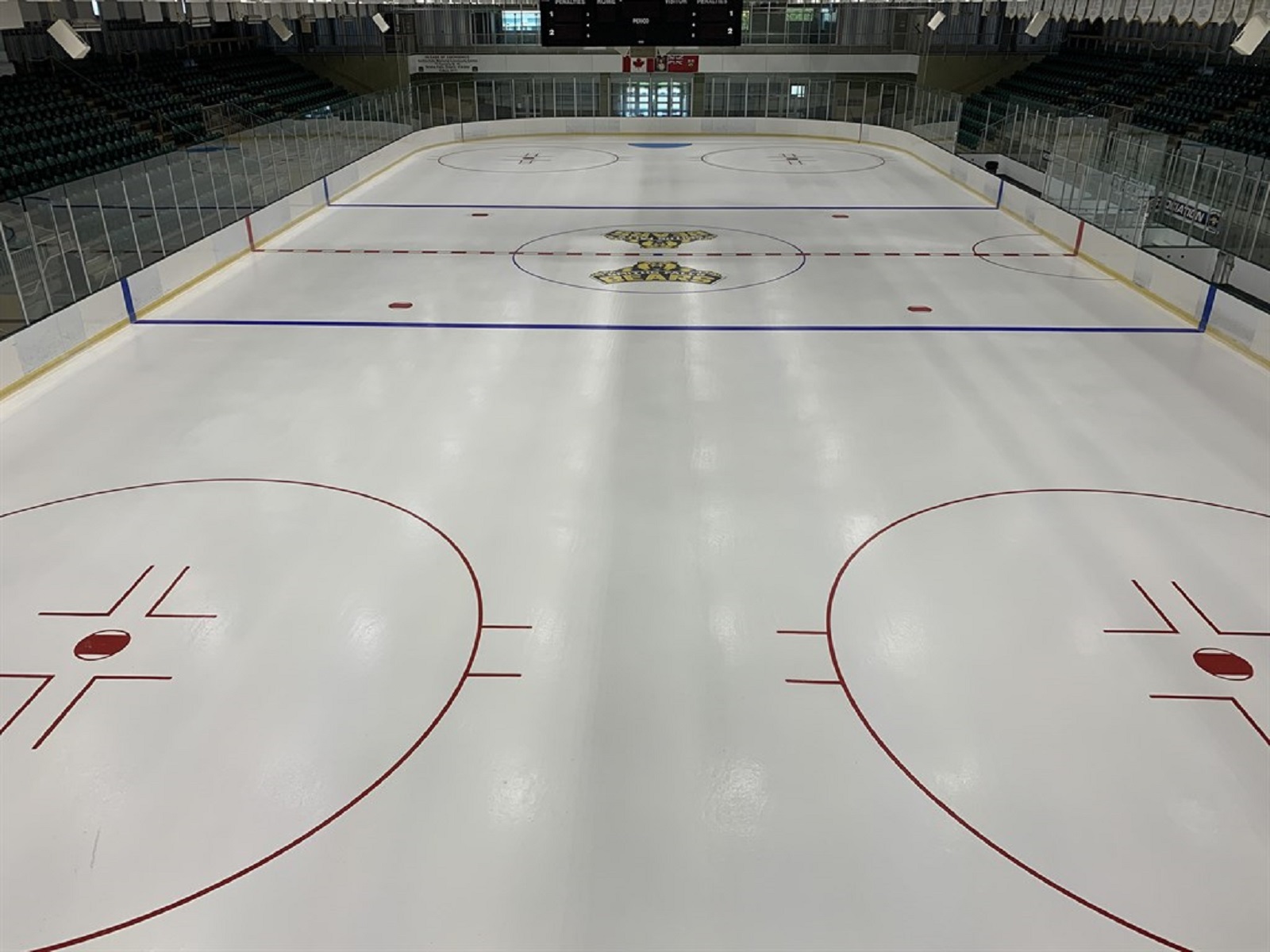 aerial image of arena ice with sports team logo