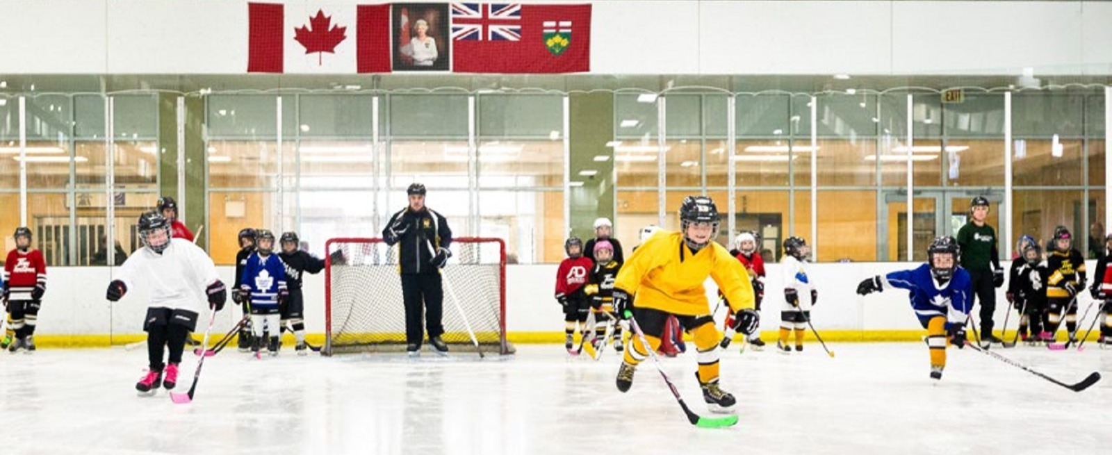 Young children skating on ice