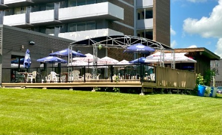 patio with chairs and umbrellas