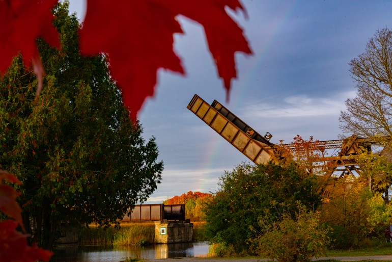 A beautiful fall shot of the Bascule Bridge with a rainbow in the background.